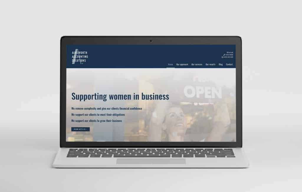 A Seedling Digital developer from Gold Coast showcasing a women's business website on a laptop.
