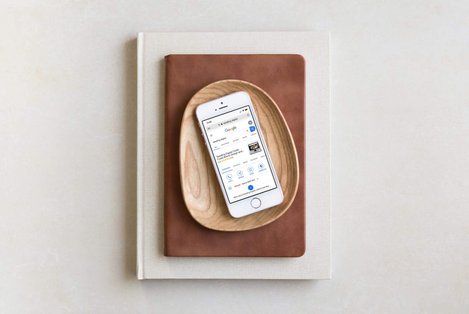 A WordPress website developer in Australia created a design featuring an iPhone on a wooden plate.